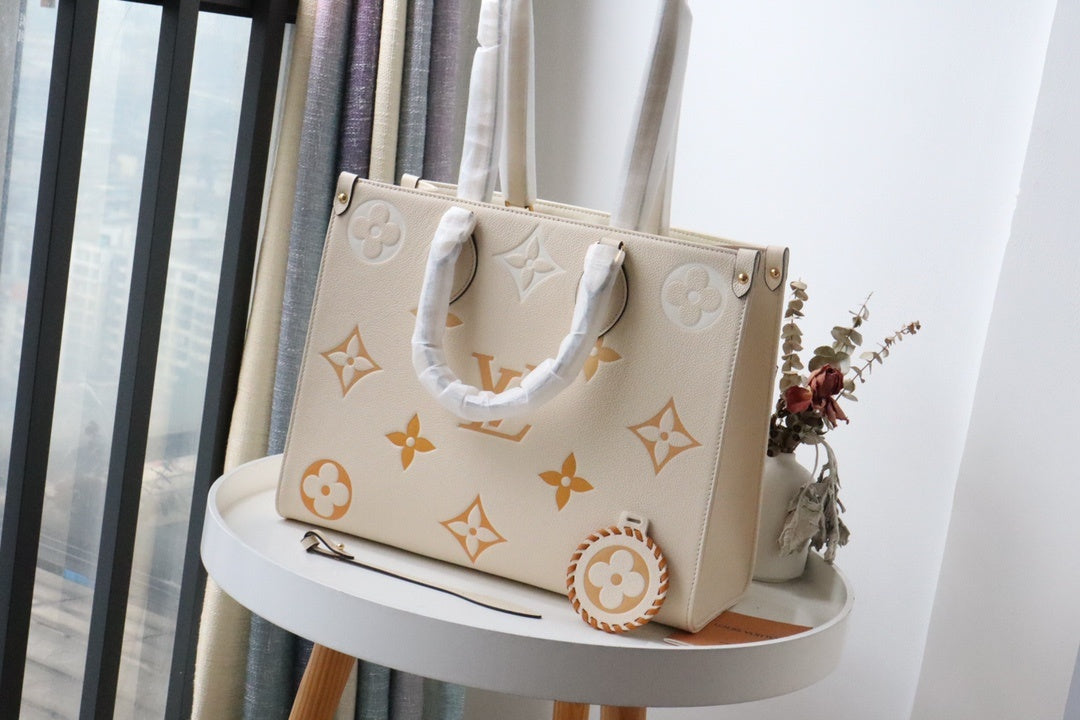 LV OnTheGo MM Tote Bag Monogram Empreinte Cream For The Pool Collection, WoHandbags 13.8in/35cm LV M45717