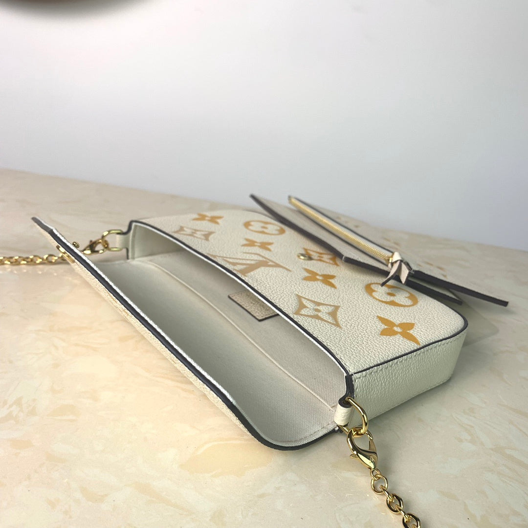 LV Monogram Empreinte Pochette 21cm White